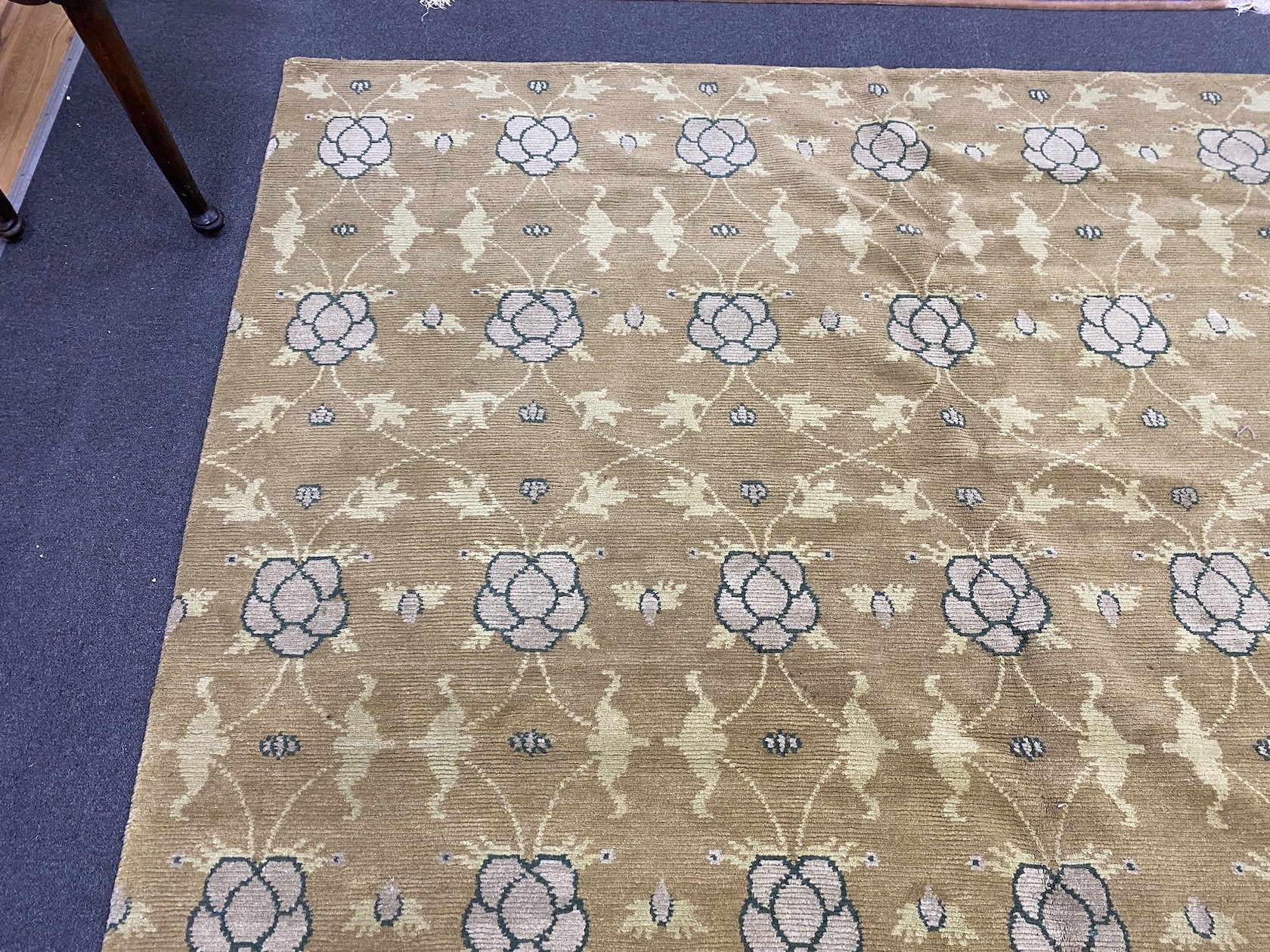 An Arts and Crafts style pale green ground carpet, 300 x 250cm